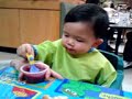 Nathan eats blue berry apple sauce
