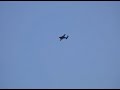 B25 nearly hits a pilot and spotter due to them standing on the active runway.