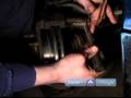 How to Inspect and Replace Car Brake Rotors : How to Install the Brake Caliper Bridge