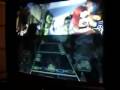 videos de Elwin 8 år spelar Guitar Hero på expert, vänd bort från TV:n