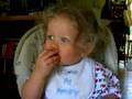 Ava eats a strawberry