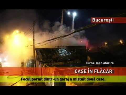 Două case mistuite de incendiu, în București
