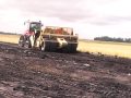 K-Tec 1233 loading Top Soil with Rocks Underneath
