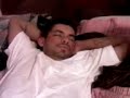 my niece's boyfriend,chuy was sleeping while i recorded him with my phone and my niece was putting make up on him.
