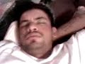 my niece's boyfriend,chuy was sleeping while i recorded him with my phone and my niece was putting make up on him.