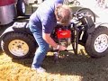 Here's a short video of a neat diesel motorcycle I saw at the Barber Vintage motorcycle show. It's built from a Yanmar 10hp diesel coupled to a variable displacement pump. Then out to hydraulic motors to turn the wheels. Looks are deceiving. There's a lot of aluminum parts to the bike. The bike only tips the scales at 300lbs. The bike can be ran in 2WD or single rear wheel drive. Speeds are about 25mph in 2wd, and 55-60mph in single wheel drive. Fuel estimates are around 100mpg! This is due to the highly efficiency of a hydraulic setup. This setup nets a 93% efficiency rating. The bikes suspension is a air shock setup. Increasing the pressure causes the bike to gain ground clearance. Also shortening the wheelbase for better handling manners. The bike was designed by Andy Wendt and built by Chris Self, Owner of Miracle Machine Works. 334-872-0121