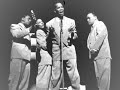 bill kenny's unsullied, poignant tenor and the sonorous recitatives of bass hoppy jones were winning trademarks of the ink spots at their peak.

