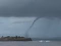 water cyclone and a plane: waterspout
