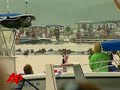 raw video: 150 wild ponies make famous swim