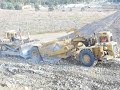 Cat 631D Scraper loaded by Cat D10N Cat 631D Scraper loaded by Cat D10N