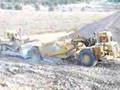 Cat 631D Scraper loaded by Cat D10N