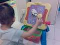 Ming Hin is playing with his new toy