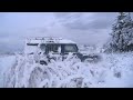Land Rover Defender and Discovery playing in the snow HD
