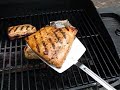 Grilling salmon perfectly isn't easy. You must first catch some salmon, preferably from Alaska (fresh Alaskan salmon is the best, right?), then you must get ready to eat. Heat up the grill (really hot), spray lots of non-stick spray (lots, I said), then put the salmon on skin side up. Cook it that way for two minutes, flip it, slather the fish with sauce, cook it for five more minutes, then slide it off the grill (without the skin) onto your waiting plate and eat it up. Make sure you have lots of nice vegetables and don't make some nasty sauce. Olive oil and butter is a good sauce. Some spices will help too.