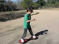 Child solves Rubiks Cube while skateboarding (ripstiking)