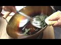 The video shows how to season a new wok