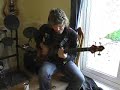Nigel Clutterbuck picks up his custom E-Bass