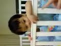 naughty enzo biting the new baby cot