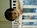 naughty enzo biting the new baby cot