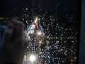 Riding Paris Ferris Wheel in Rain at Night