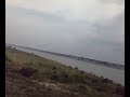 2819 Orissa Sampark Kranti Express , hauled by a Ghaziabad WAP 4 skipping Naini Junction just before allahabad and then crossing the Yamuna at Allahabad before approaching the Allahabad station.