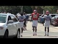 Video of Easley and Powell walking/running to practice