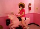Gabby rides the pink pig again