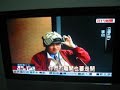 taiwan legislator, li ao, sprays tear gas in the legislature while sporting a v mask.