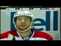 Erik Karlsson holds the small David Desharnais in the air while fighting on the board.