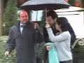 edouard baer is walking under the rain in paris.