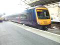 fTPE 170306 & 170303 depart Huddersfield with howl (20/11/08)