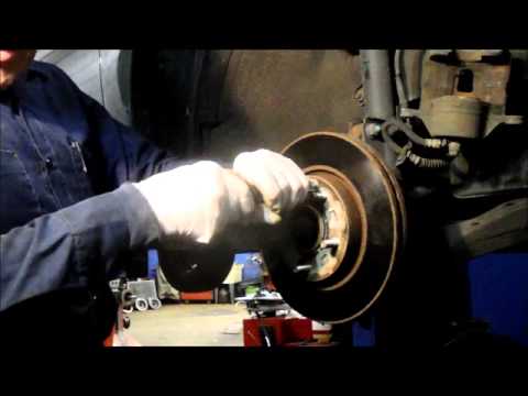 How to replace the front brakes and rotors on a 2006 Kia Sportage