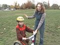 No more training wheels, Colin learning to ride his bicycle on grass