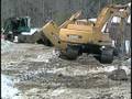 Skidder Driver Escapes When Vehicle Tumbles Into River
