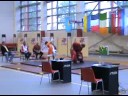 Couple juggling kettlebells in traditional costume