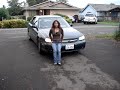 Jenilee pushing a Car