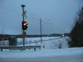 Express train 705 passes Kaatopaikka level crossing