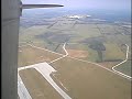 world war ii reenactors jumping from a wwii-vintage c-47 in authentic uniforms.
