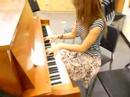 Sara playing the piano. Sara playing the piano.