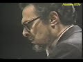 Encore performed during a concert in the early eighties celebrating the return of function in his right hand. Additional backstage footage is provided.