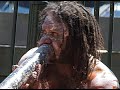 aboriginal man playing didjeridoo at circular quay