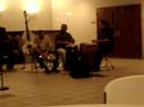 Tony Tumbador congero sits with  (Flutist) Ruiz