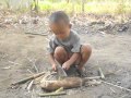 Little Boy Cuts Wood