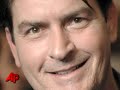 charlie sheen's wife has told aspen police the actor pinned her on a bed, put a knife to her throat and threatened to kill her after she said she wanted a divorce. (dec. 28)