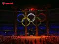 t�l�vision suisse romande-drapeau italien port� par carla bruni-accueil pr�sident de la r�publique-music ... tout � -carla bruni carrying a folded italian flag-opening ceremony xx olympic winter games torino 2006 following the exit of the flaming skaters, the sounding of seven alphorns to the notes of the occitan hymn signaled the beginning of the next segment that paid tribute to the alps and the seven alpine countries: italy, france, switzerland, liechtenstein, austria, germany and slovenia. artificial snow and life-size pine tree shapes set the mood for this segment as the stage was transformed from red to white. this section paid tribute to the italian flag whose entrance was led by 26 olympic medalists in white suits and gowns marching in two files. following the athletes was model and singer carla bruni carrying a folded italian flag. bruni wore a sparkling gown by giorgio armani, inspired by crystal and ice.