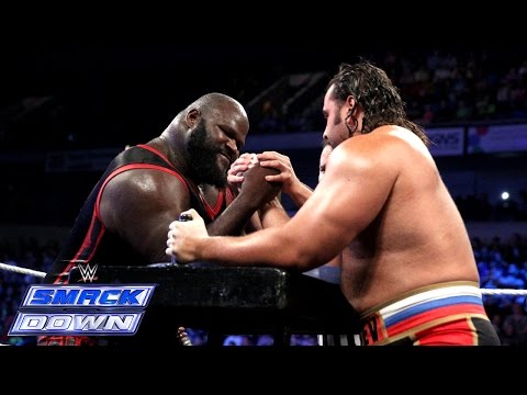 wrestling - It's a battle of strength between Mark Henry and Rusev in an International Arm Wrestling Contest.