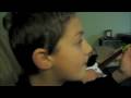 Boys playing Rock Band on XBOX 360