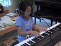 What a wonderful world - a 7 year old child singer pianist