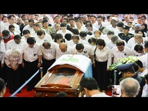 11:15am: Mourners bowed three times as mark of respect