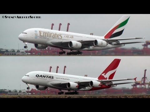Emirates - A Qantas A380 (VH-OQJ) and an Emirates A380 (A6-EDY) take off at Sydney Airport together for the flyover in the City. This was to mark the start of the Qanta...